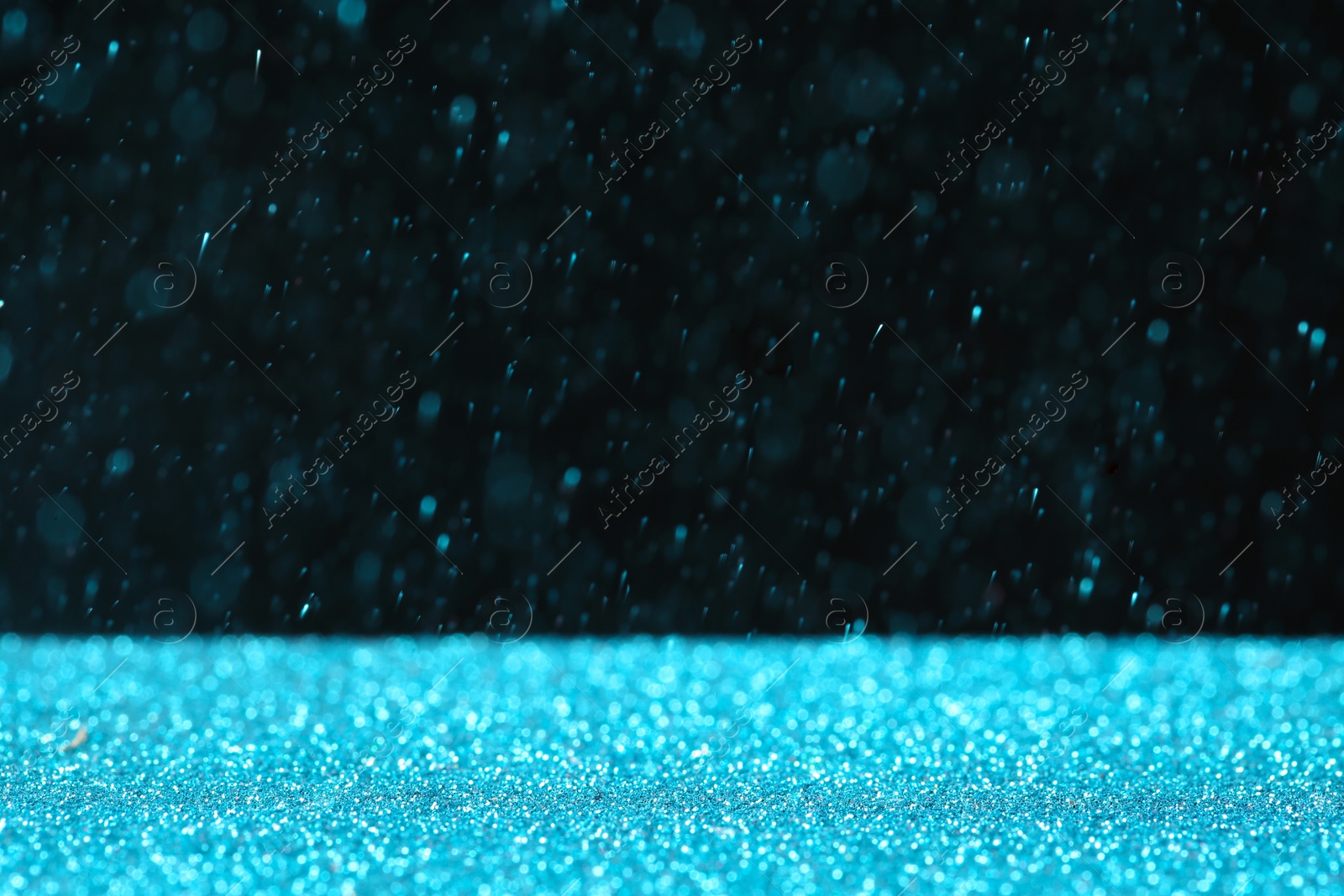 Photo of Glitter on table against dark background, space for text. Bokeh effect