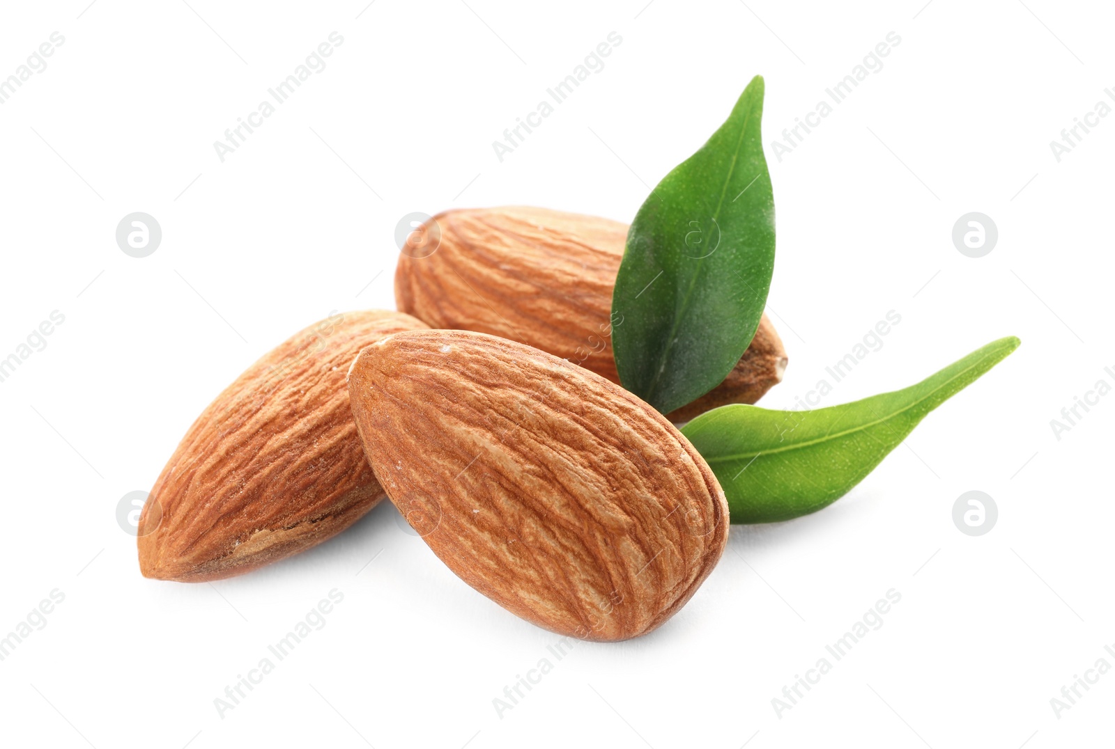 Photo of Organic almond nuts and leaves on white background. Healthy snack