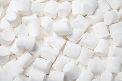 Photo of Delicious white puffy marshmallows as background, top view