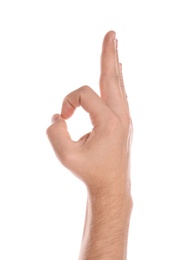 Photo of Man showing OK gesture on white background, closeup of hand