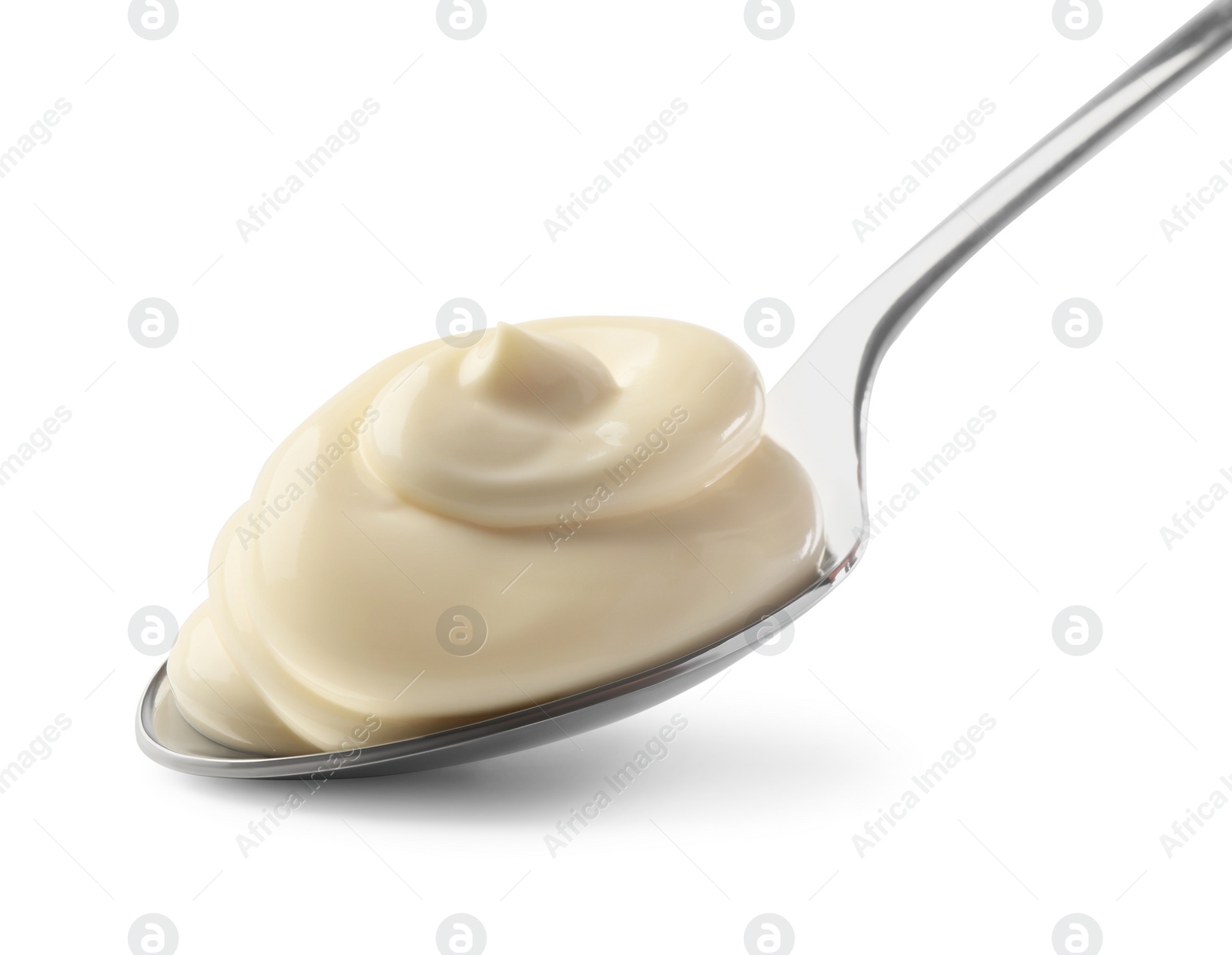 Photo of Natural yogurt in spoon isolated on white