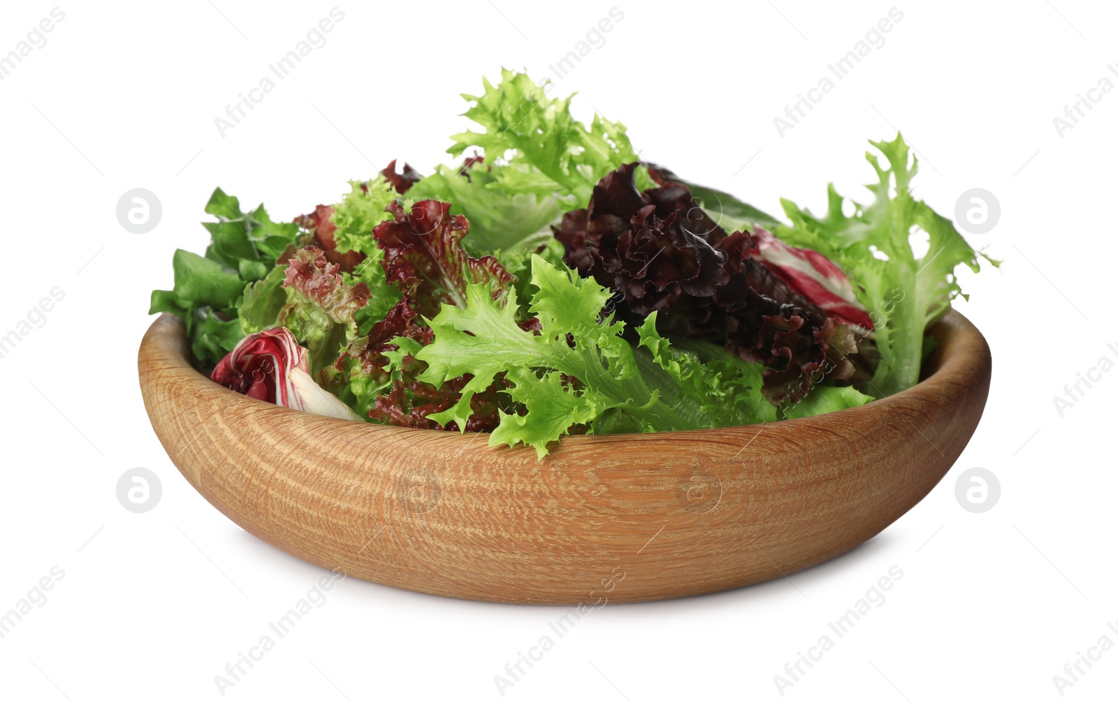 Photo of Wooden bowl with leaves of different lettuce on white background