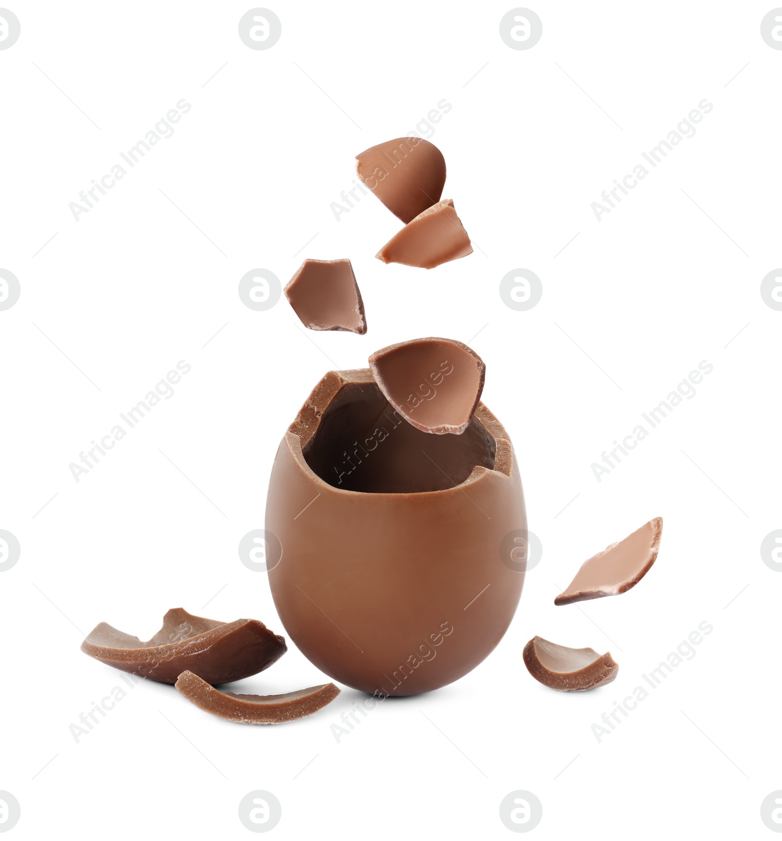 Image of Exploded milk chocolate egg on white background