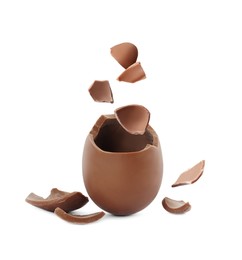 Image of Exploded milk chocolate egg on white background