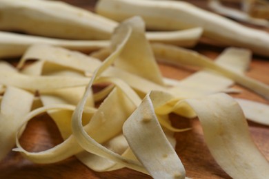 Sliced fresh parsnip on wooden board, closeup