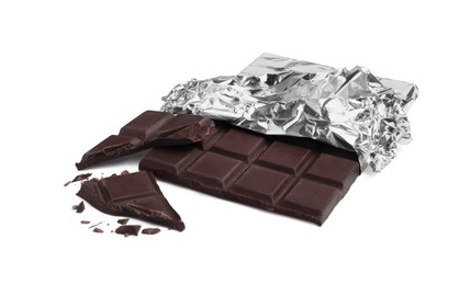 Pieces of delicious dark chocolate bar on white background