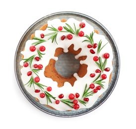 Photo of Traditional Christmas cake decorated with glaze, pomegranate seeds, cranberries and rosemary isolated on white, top view