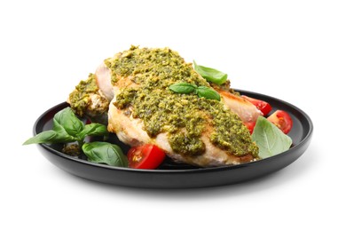 Photo of Delicious chicken breasts with pesto sauce, tomatoes and basil isolated on white