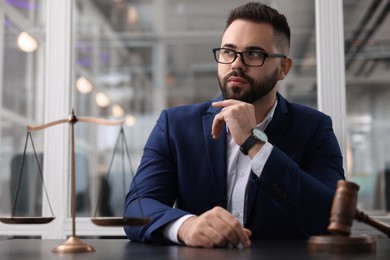 Photo of Portrait of handsome lawyer at table in office