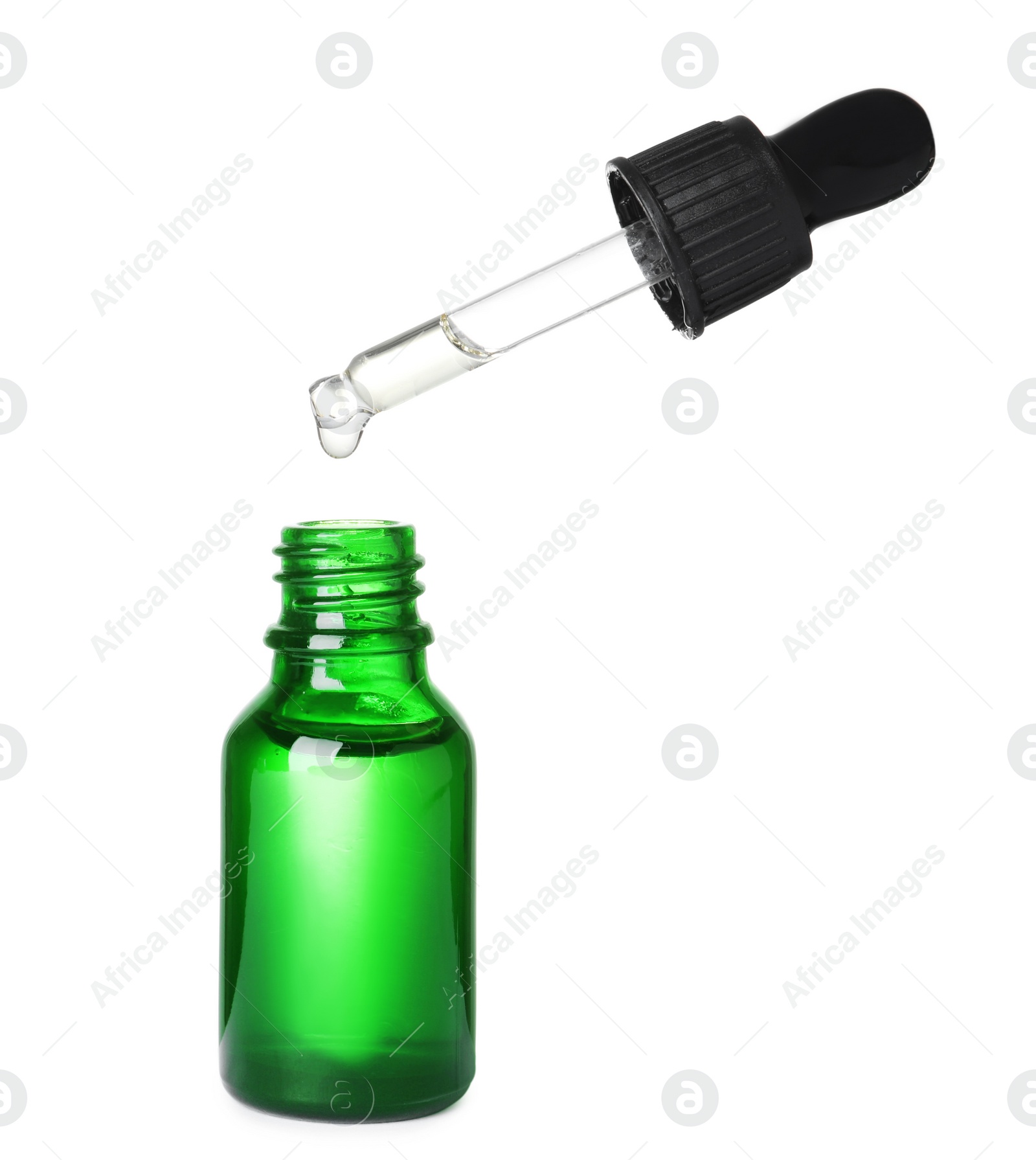 Photo of Bottle and pipette with essential oil on white background