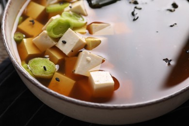 Bowl of delicious miso soup with tofu, closeup