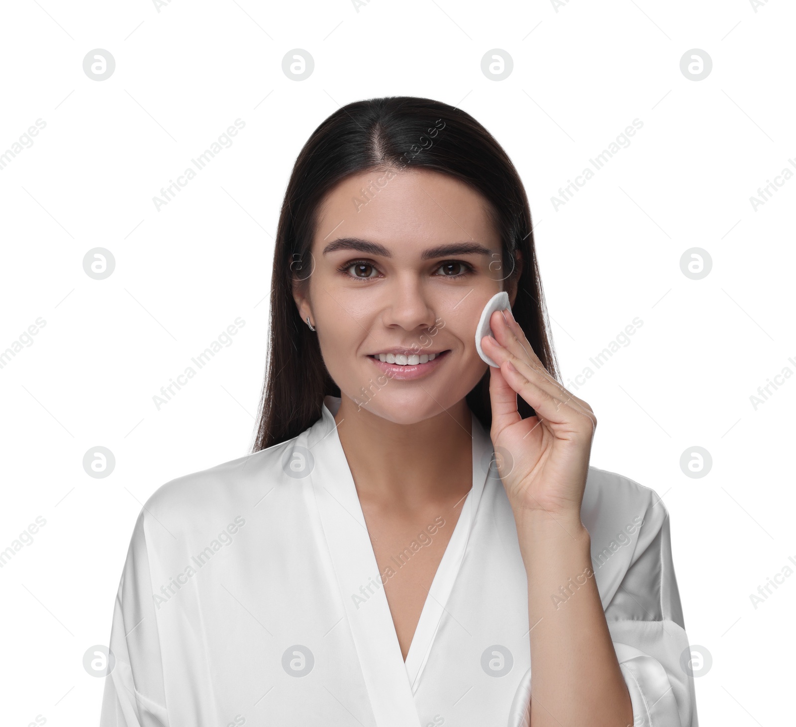 Photo of Young woman cleaning her face with cotton pad on white background