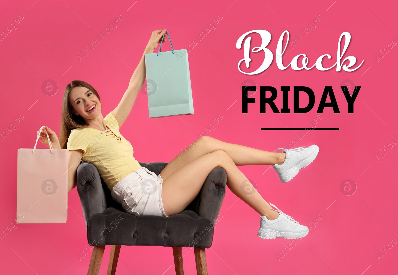 Image of Black Friday Sale. Beautiful young woman with shopping bags in armchair on pink background
