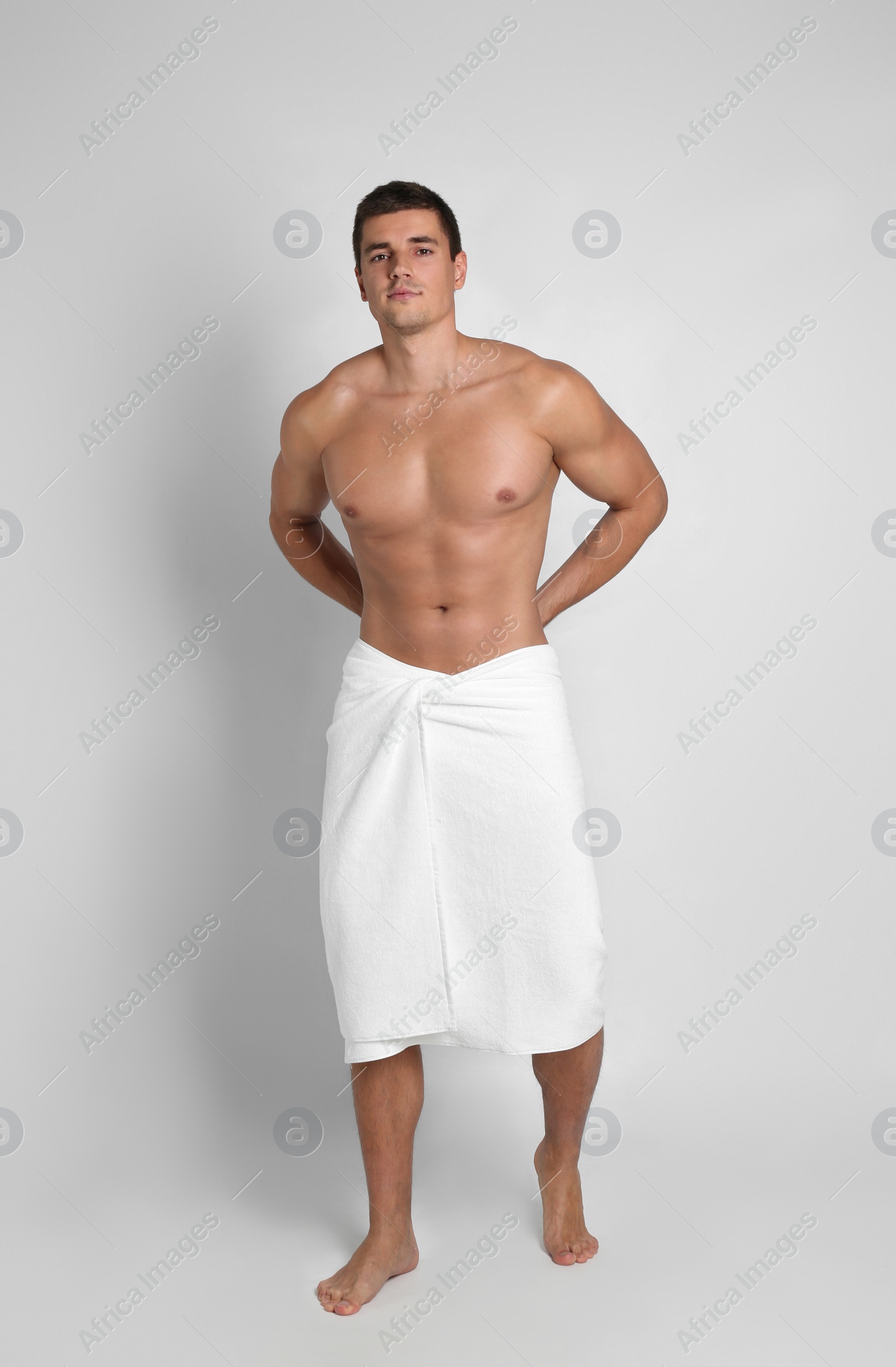 Photo of Man with sexy body on light background
