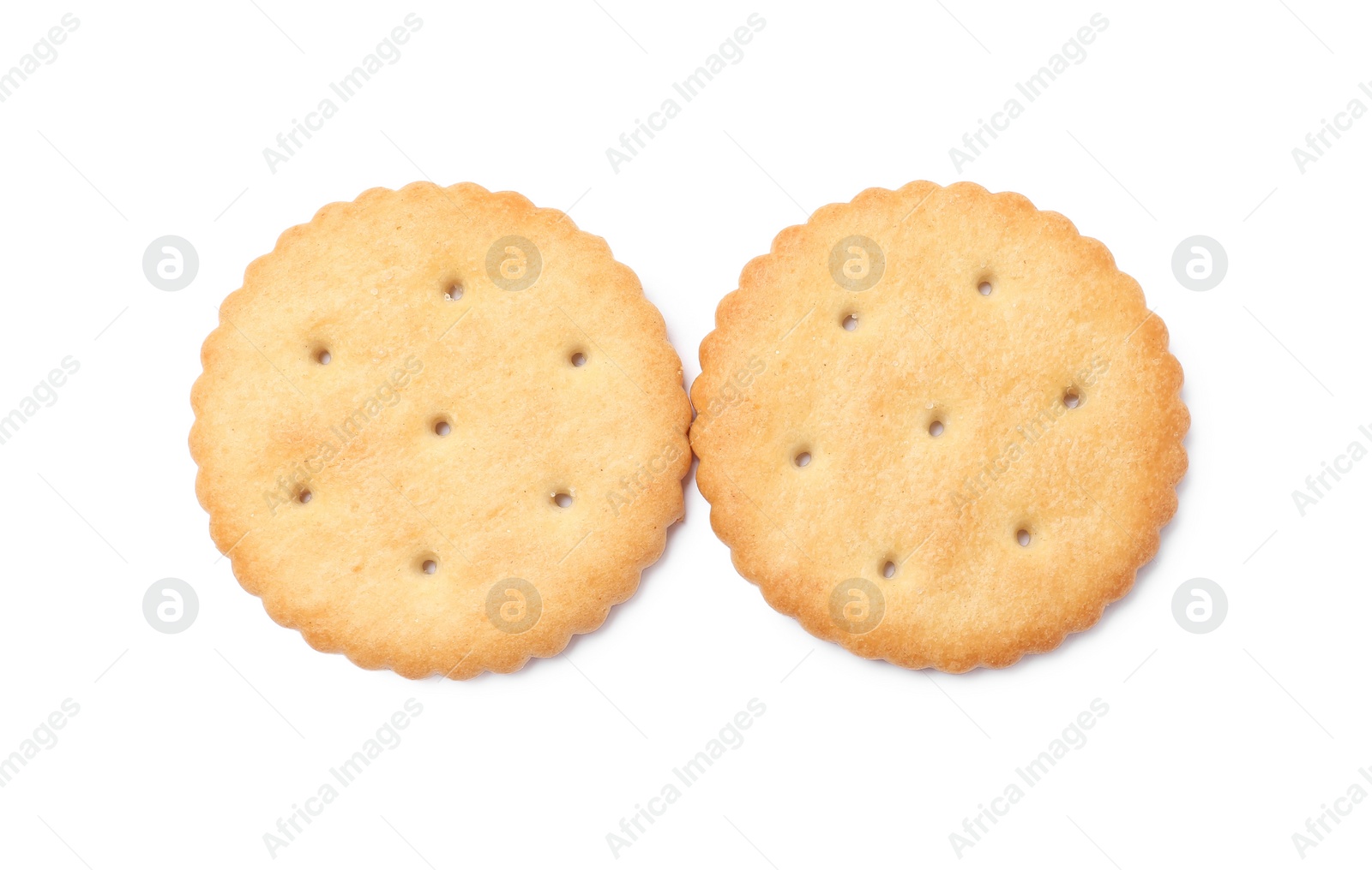 Photo of Two crispy crackers isolated on white, top view. Delicious snack