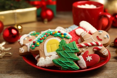 Photo of Delicious Christmas cookies on wooden table, closeup