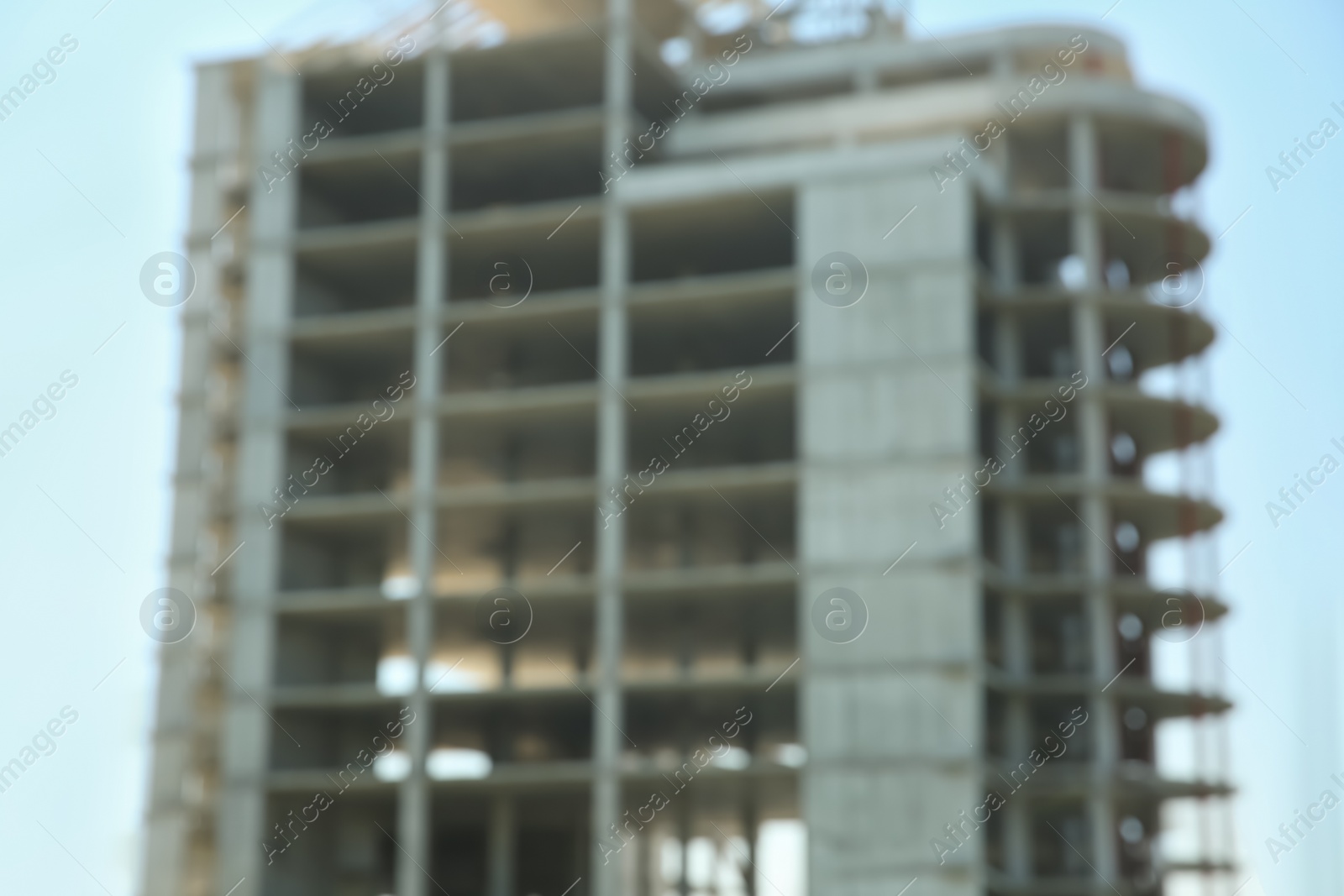 Photo of Blurred view of unfinished building against blue sky