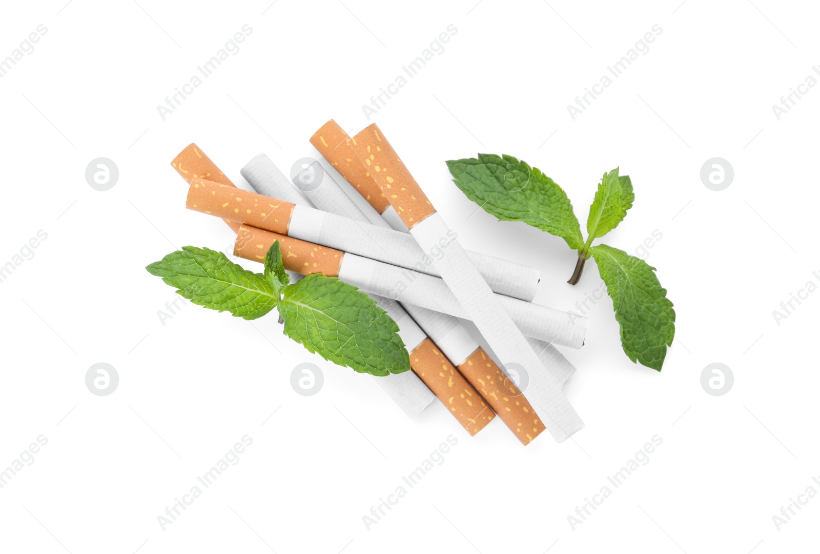 Photo of Menthol cigarettes and fresh mint leaves on white background, flat lay