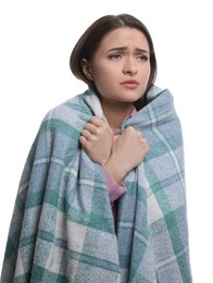 Woman wrapped in blanket suffering from cold on white background