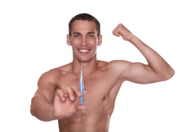 Photo of Athletic man with syringe against white background, focus on hand. Doping concept