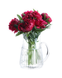 Photo of Bouquet of beautiful red peonies in glass jug isolated on white