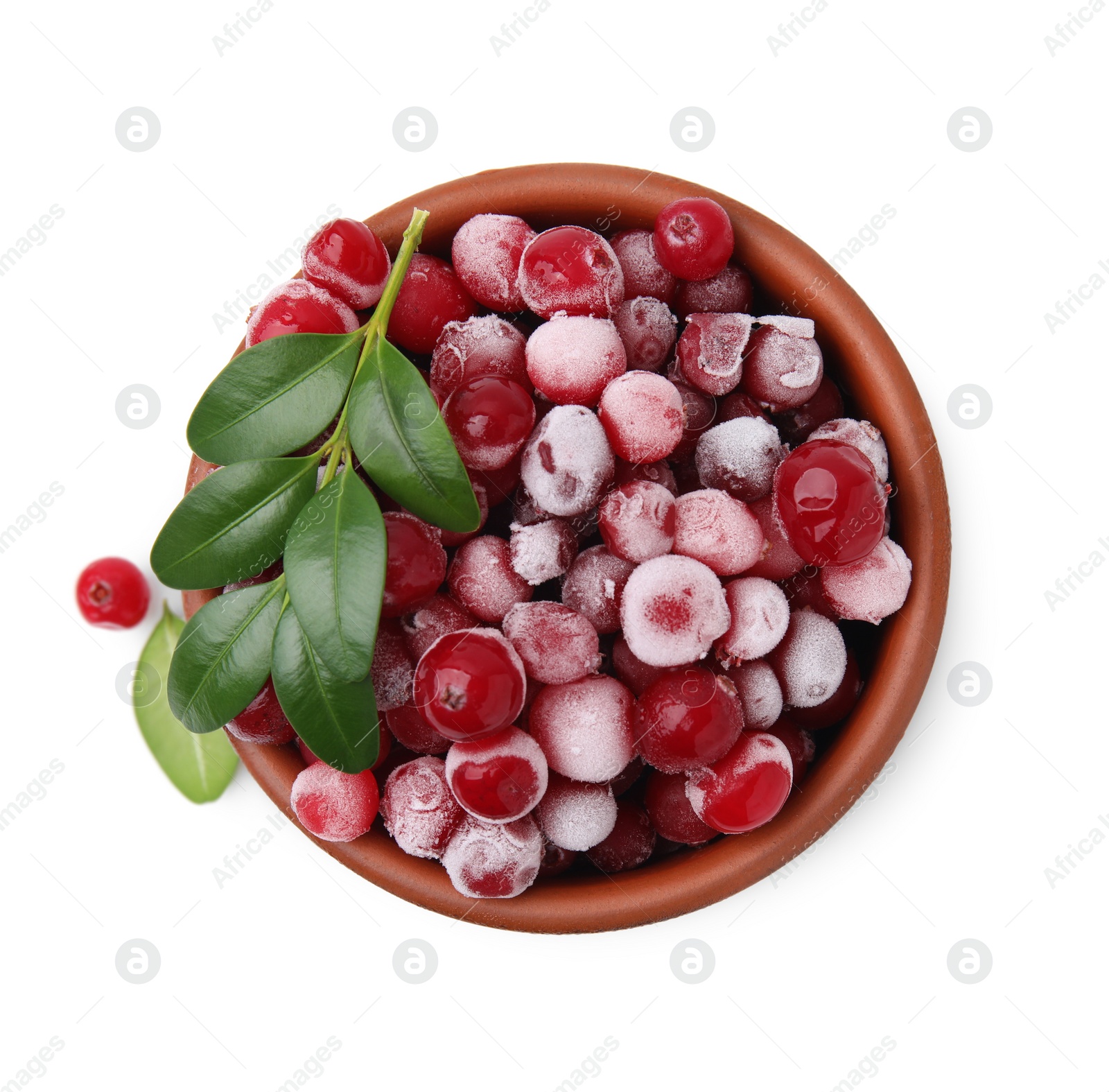 Photo of Frozen red cranberries and green leaves isolated on white, top view