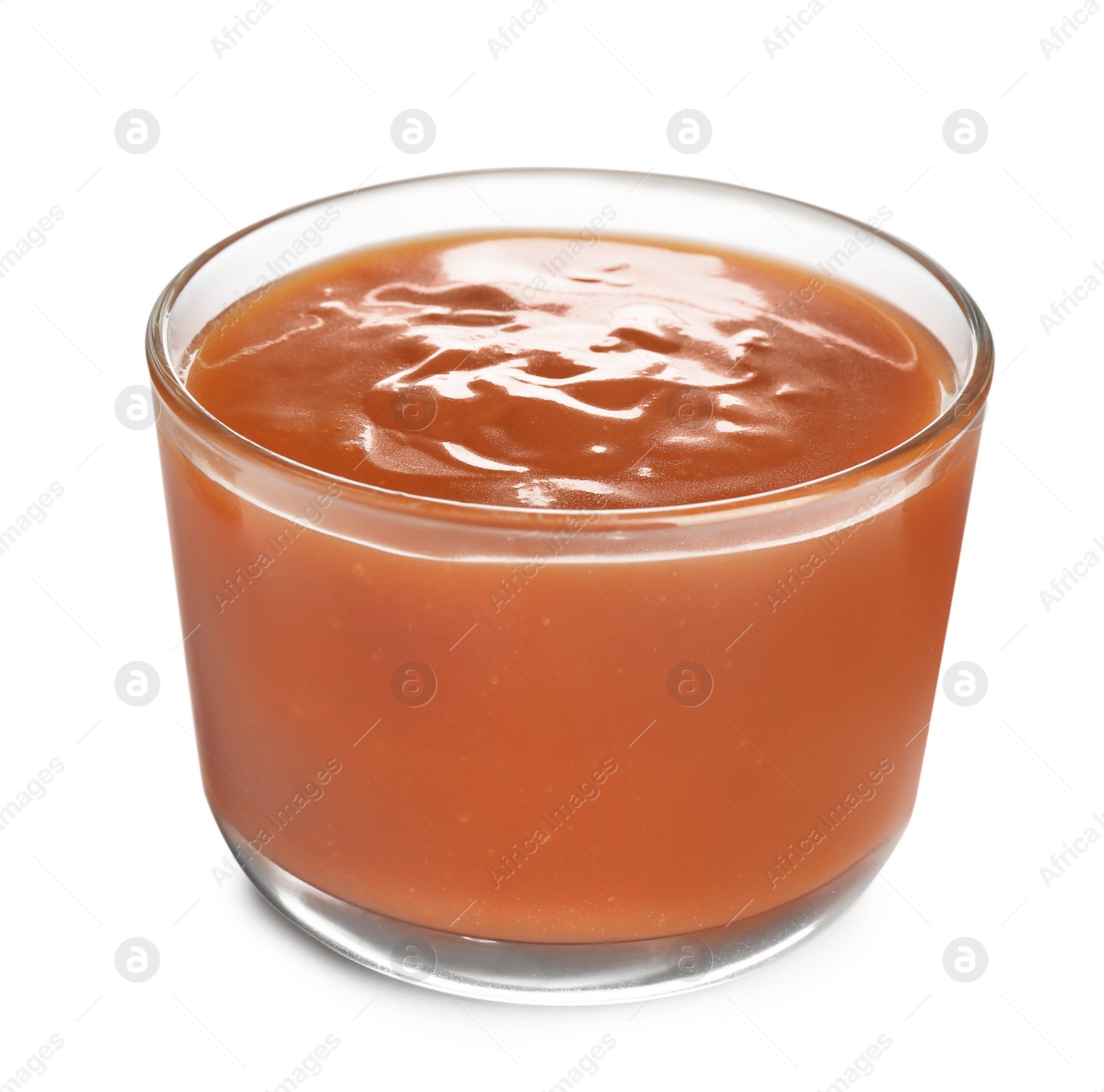 Photo of Glass of tasty caramel sauce isolated on white