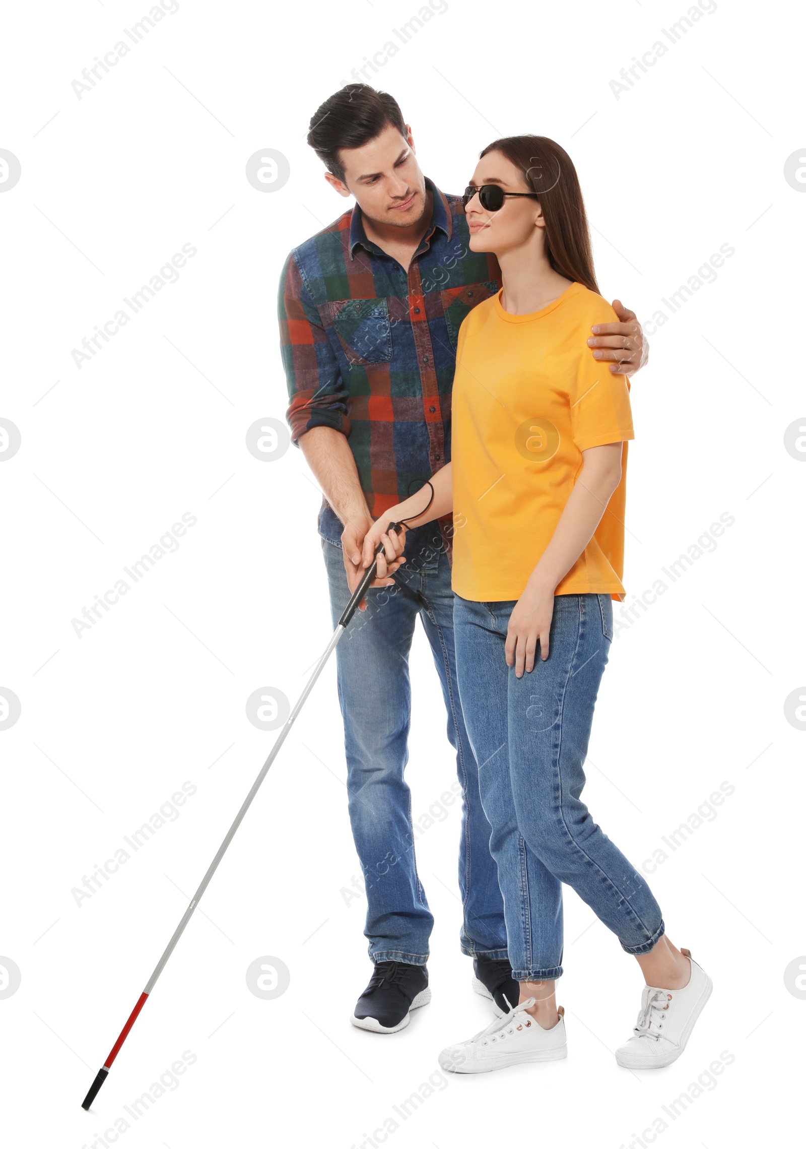 Photo of Man assisting blind woman with long cane on white background