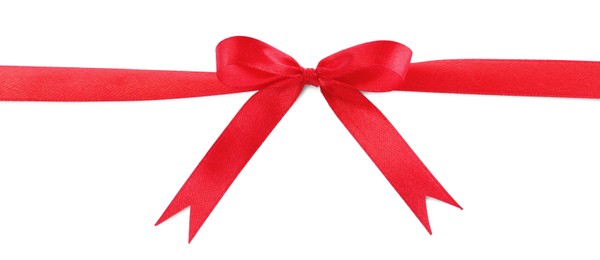 Photo of Red satin ribbon with bow on white background, top view