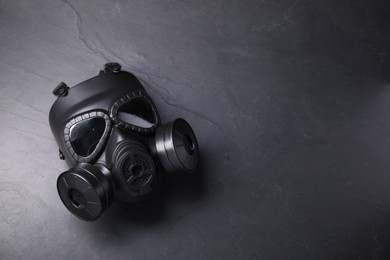 One gas mask on grey textured background, top view. Space for text