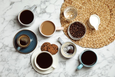 Flat lay composition with cups of coffee on marble background. Food photography