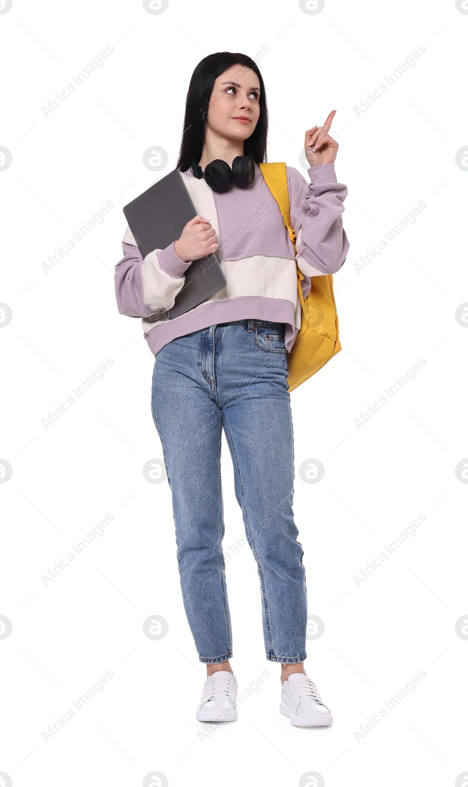 Photo of Student with backpack and laptop on white background