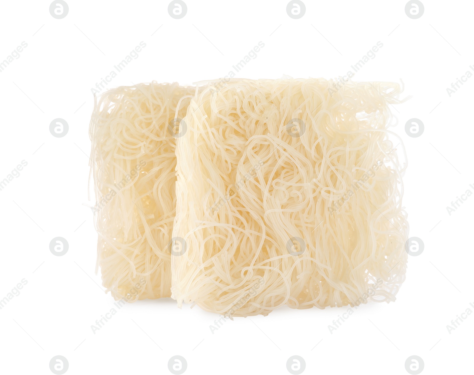 Photo of Bricks of dried rice noodles isolated on white. East Asian cuisine