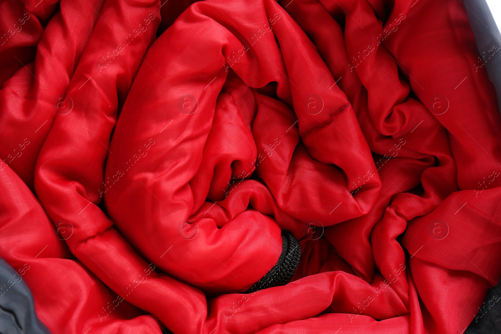 Photo of Sleeping bag as background, closeup. Camping equipment