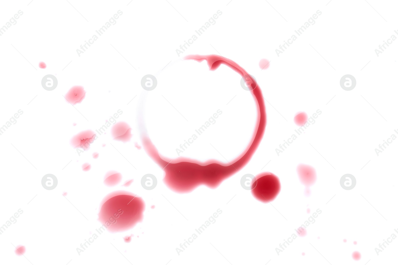 Photo of Red wine ring and drops on white background, top view