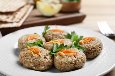 Photo of Plate of traditional Passover (Pesach) gefilte fish on table, closeup