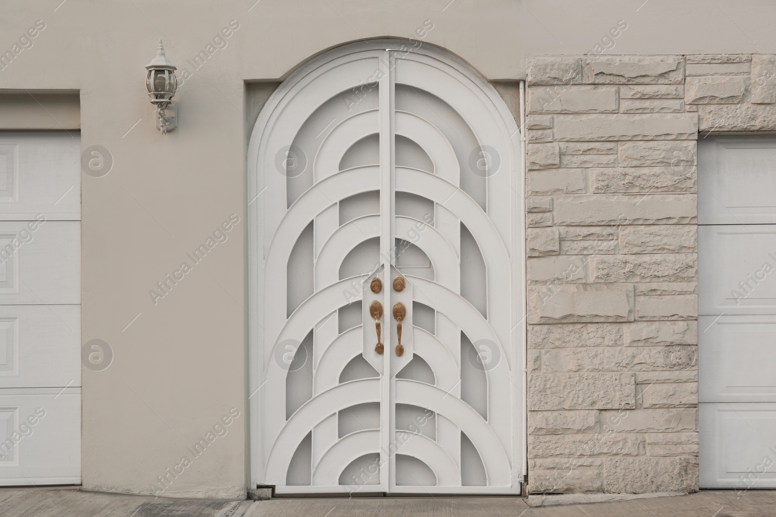 Photo of Entrance of house with beautiful arched door