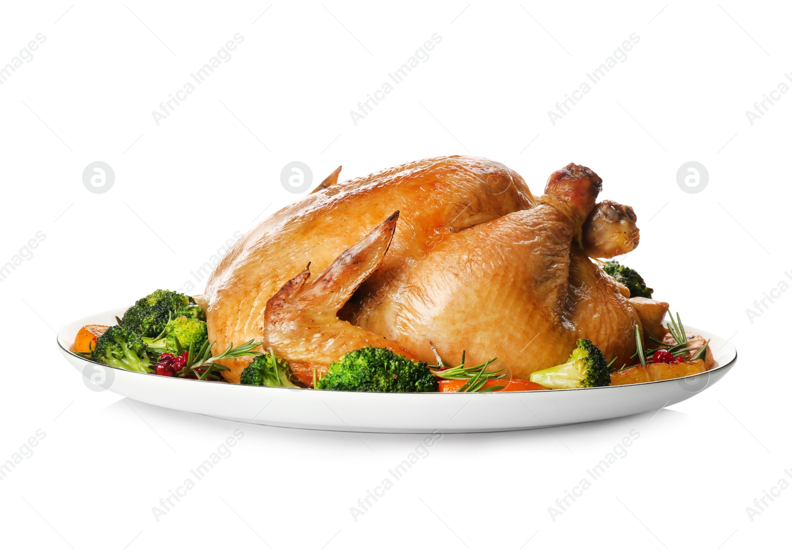 Photo of Roasted chicken with oranges and vegetables isolated on white