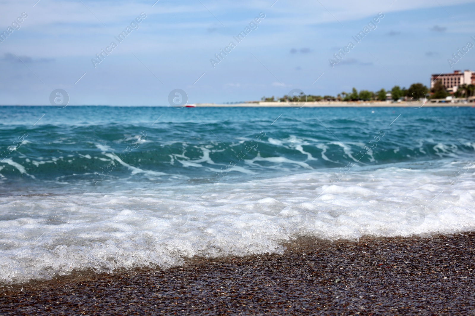 Photo of Beautiful view of foamy wave on sea beach