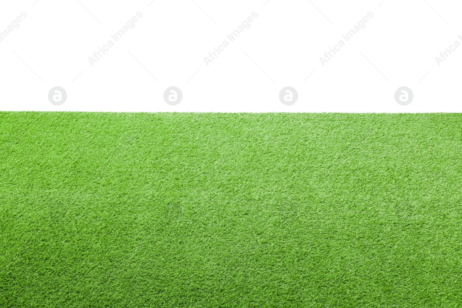 Photo of Green artificial grass surface isolated on white