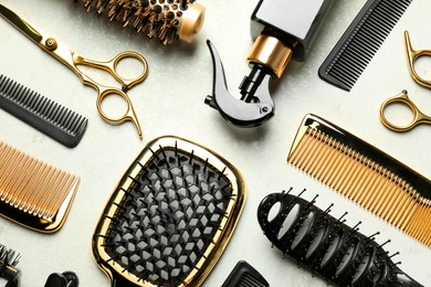 Photo of Hairdressing tools on light background, flat lay