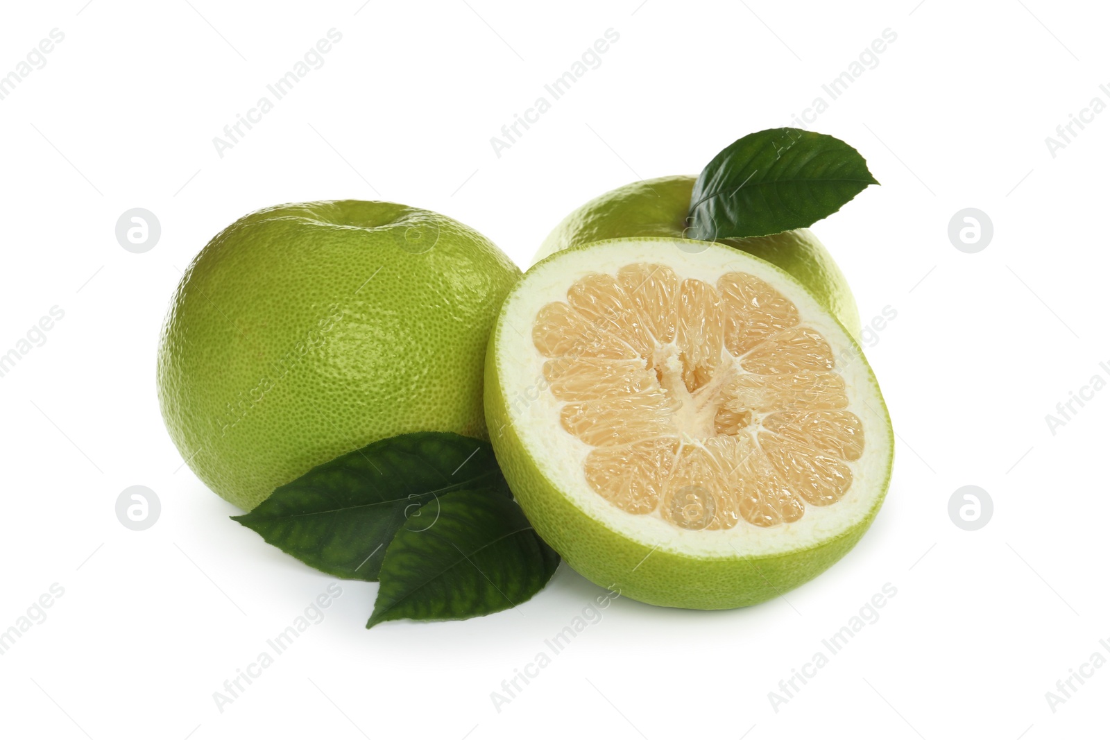 Photo of Whole and cut sweetie fruits with green leaves on white background