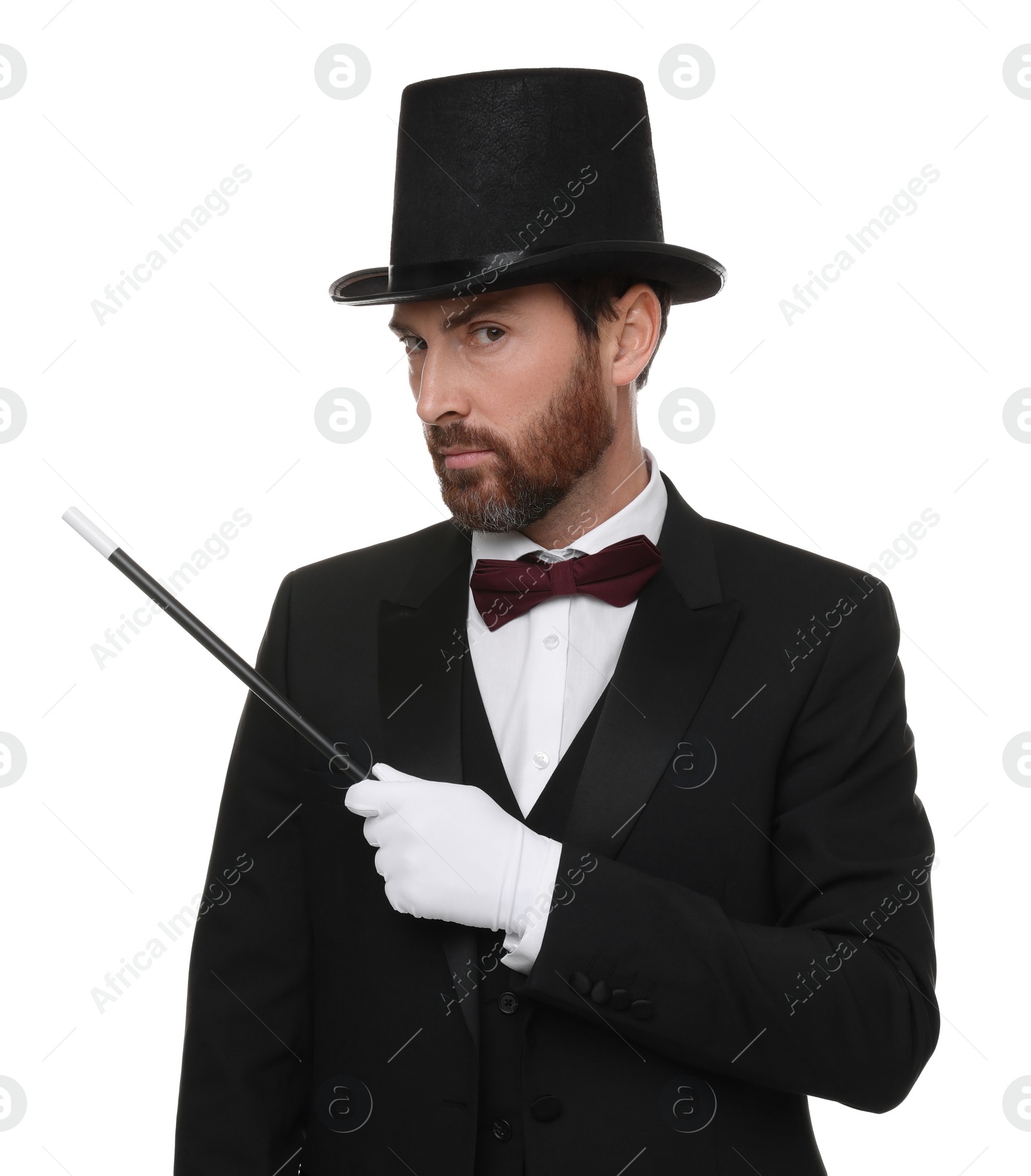 Photo of Magician in top hat holding wand on white background