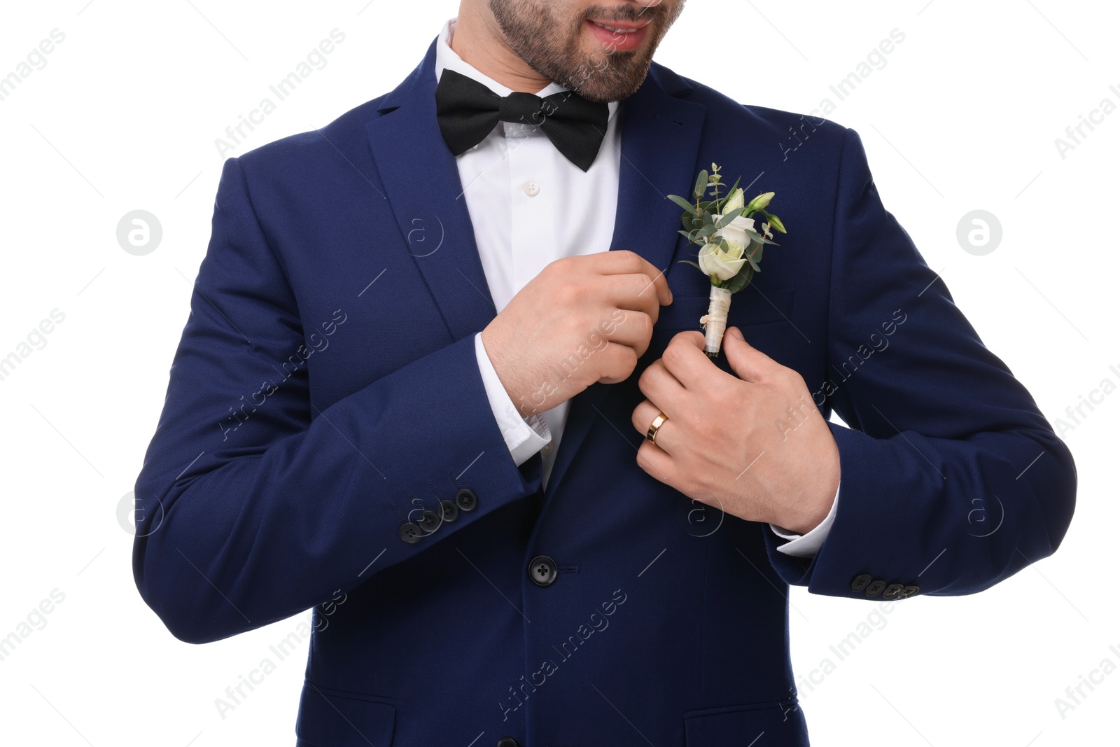 Photo of Groom with boutonniere on white background, closeup. Wedding accessory