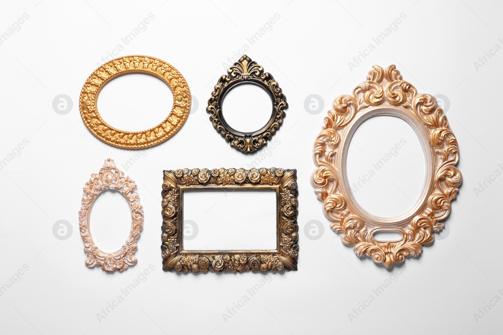 Photo of Blank vintage frames hanging on white wall