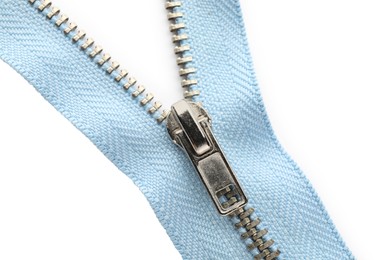 Photo of Light blue zipper on white background, top view