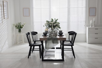 Festive table setting with beautiful tableware and decor indoors