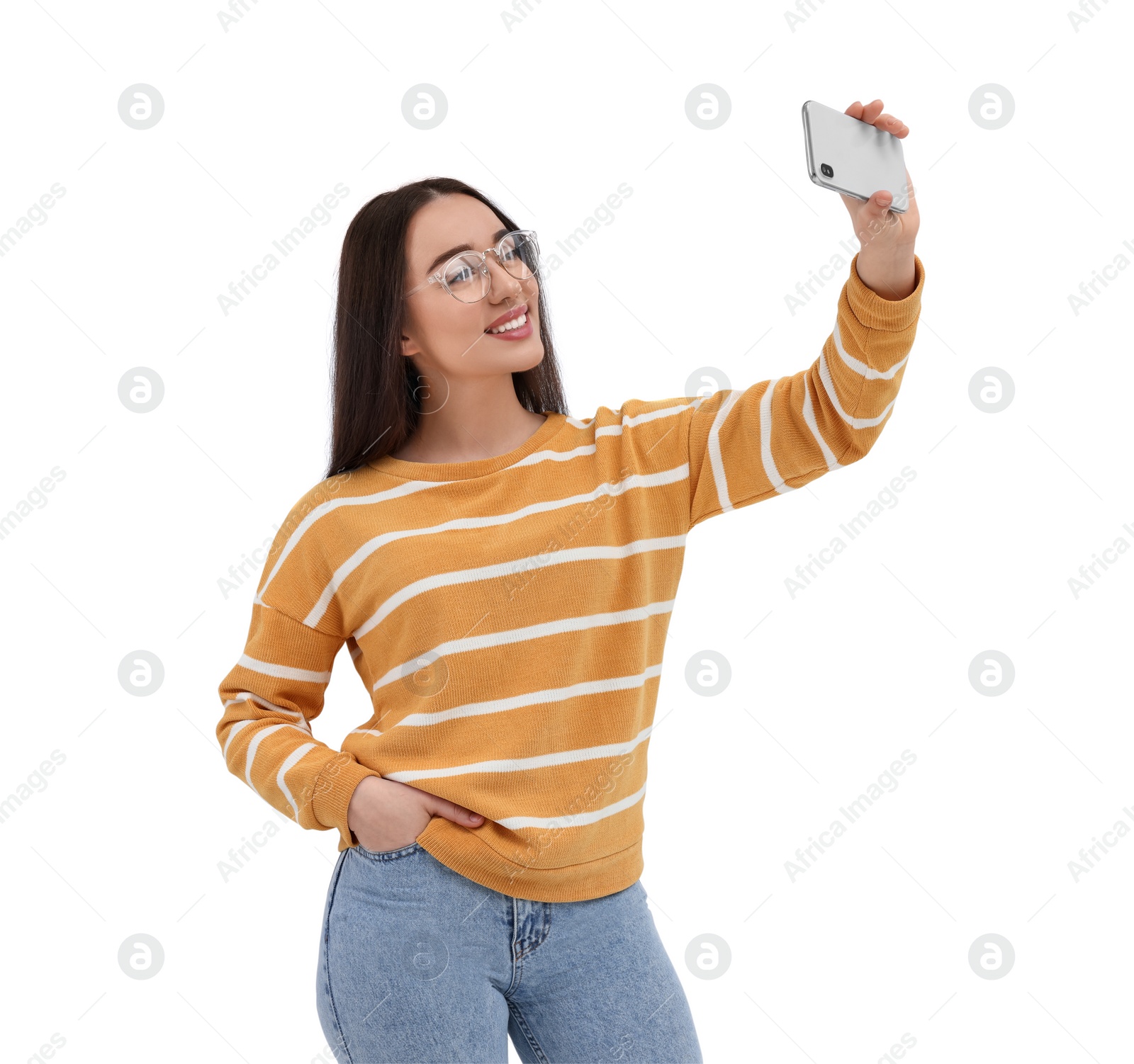 Photo of Smiling young woman taking selfie with smartphone on white background