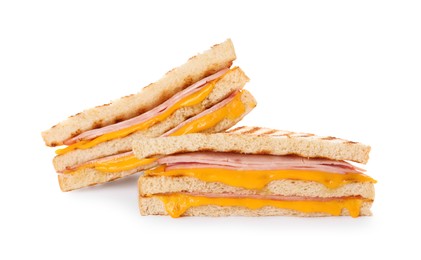 Photo of Delicious grilled sandwiches with ham and cheese isolated on white