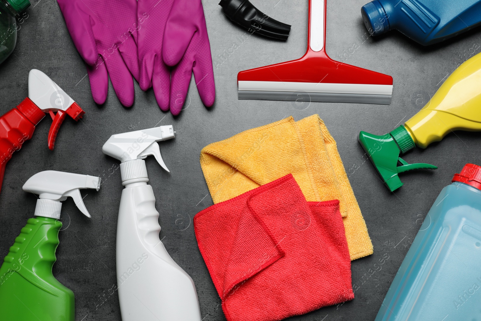Photo of Many different car cleaning products on dark background, flat lay